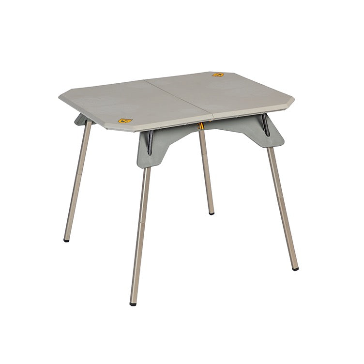 The Moonlander™ Dual-Height Camp Table, by NEMO Equipment, is a compact, portable folding table with a gray top and metal legs. Its versatile dual-height design makes it an ideal addition to any camp kit for various outdoor adventures.