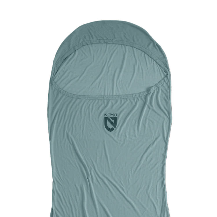 A light blue NEMO Equipment Tracer™ Endless Promise® Sleeping Bag Liner with hood, made from odor-resistant THERMOLITE EcoMade fabric, is displayed flat against a white background.