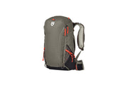 The NEMO Equipment Persist™ Men's 30L Endless Promise® All-Adventure Backpack, in gray and black with orange zipper pulls, side pockets, padded shoulder straps, and a hip belt, stands upright on a white background.