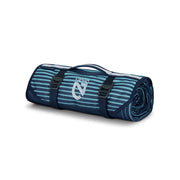 The NEMO Equipment Victory™ Patio Waterproof Blanket, featuring blue and teal stripes, black buckles, and a carrying handle, is the perfect ground cover or picnic blanket for any patio adventure.