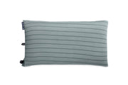 The NEMO Equipment Fillo™ Wide Camping Pillow is a rectangular, light gray pillow with horizontal stripes and a small black tag on the side, featuring a cushioned sleeping surface and shown on a white background.