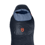 The NEMO Equipment Tempo™ Men's Endless Promise Synthetic Sleeping Bag is dark blue with a lighter blue hood and showcases the orange NEMO logo on the front, ideal for side sleepers.