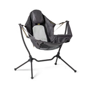 The NEMO Equipment Stargaze™ Reclining Camp Chair is a black and gray folding chair with a fabric sling seat, arm supports, and headrest for a hammock-like experience.
